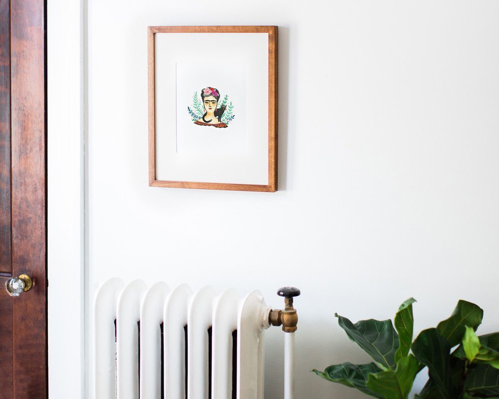 framed 8x10 frida kahlo art print illustration hanging on white wall