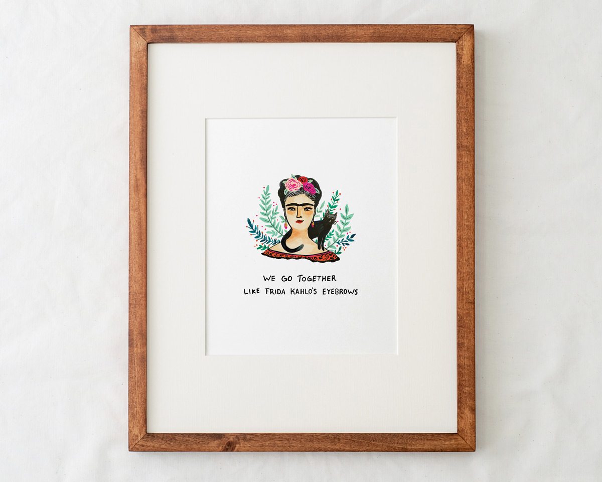 8x10 frida kahlo art print illustration with text that says we go together like frida kahlo's eyebrows in a natural wood frame