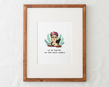 8x10 frida kahlo art print illustration with text that says we go together like frida kahlo's eyebrows in a natural wood frame