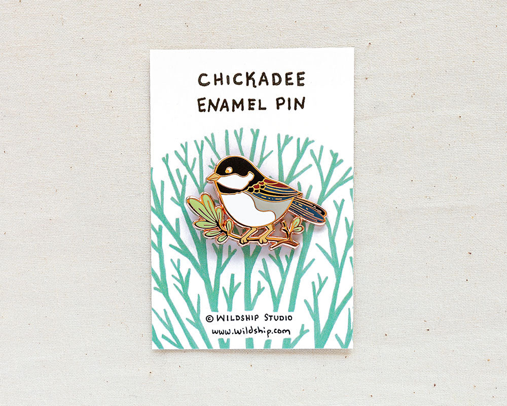 chickadee enamel pin in packaging by wildship studio