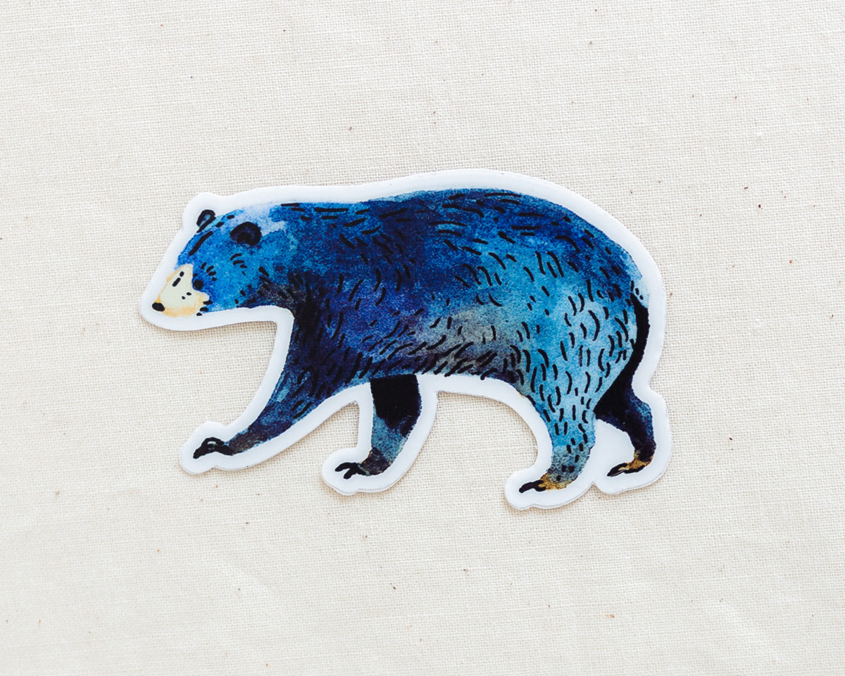 a cute black bear vinyl sticker by wildship studio