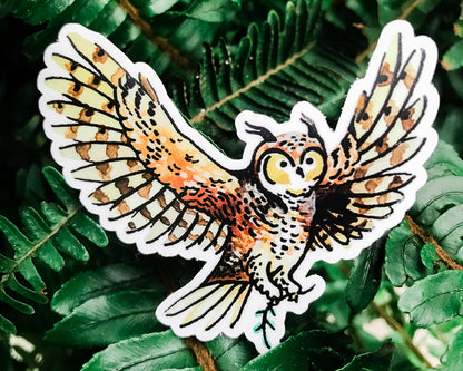 cute owl vinyl animal sticker art by wildship studio against plant background