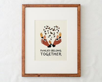 close-up detail of families belong together artwork