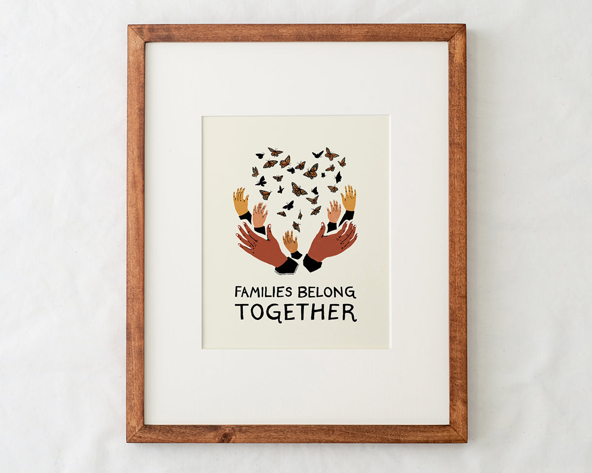 close-up detail of families belong together artwork