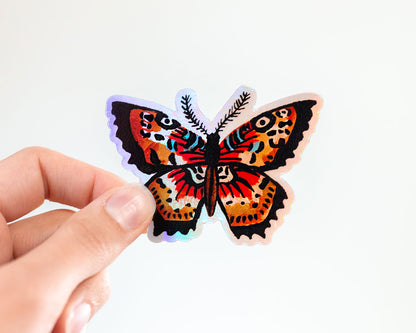 hand holding cute holographic butterfly vinyl animal sticker by wildship studio