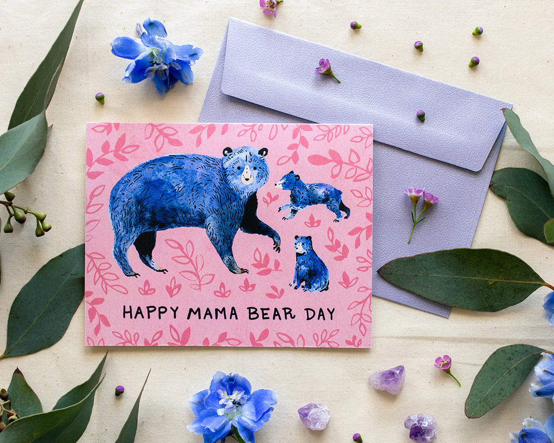 Mothers Day card with blue bears and the words Happy Mama Bear Day styled with florals and lavender envelope