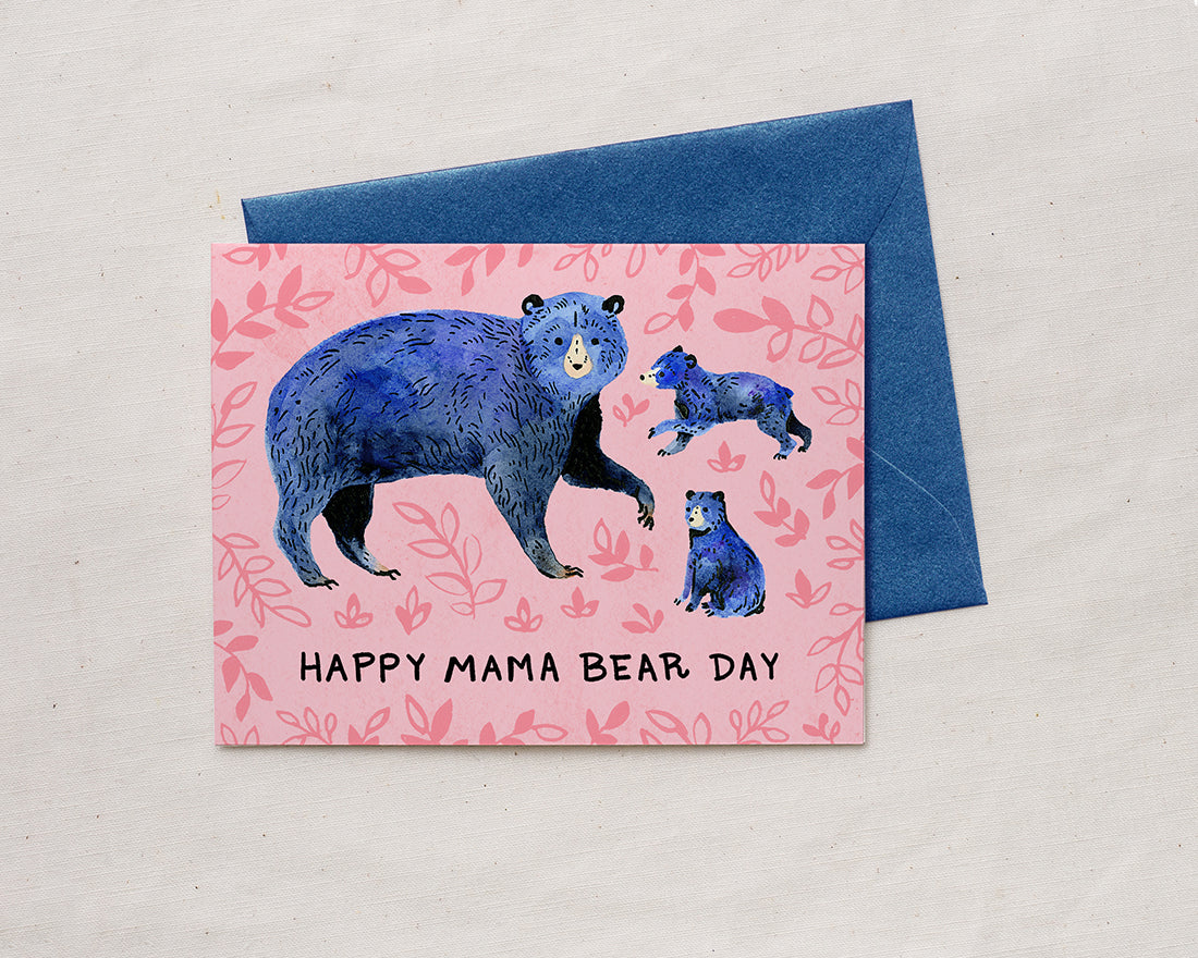 Mother's Day card with illustration of blue mom bear and two bear cubs with the words happy mama bear day and lavender envelope