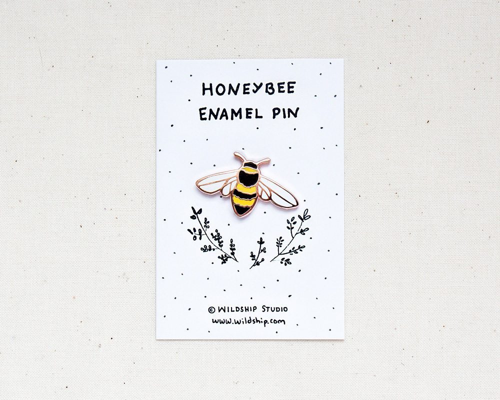 Honeybee enamel bee pin in packaging by Wildship Studio