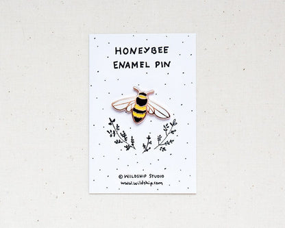 Honeybee enamel bee pin in packaging by Wildship Studio