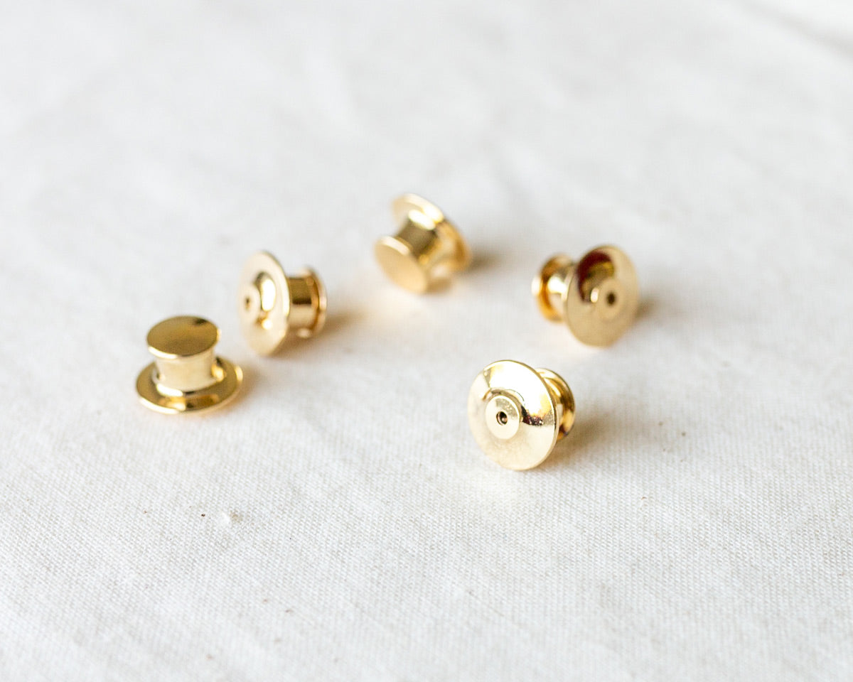 set of five deluxe gold locking pin backs