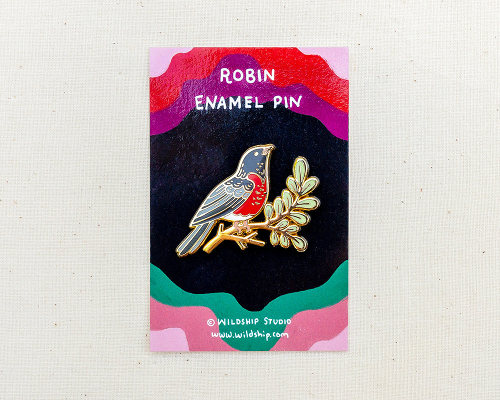 robin enamel pin in packaging by wildship studio